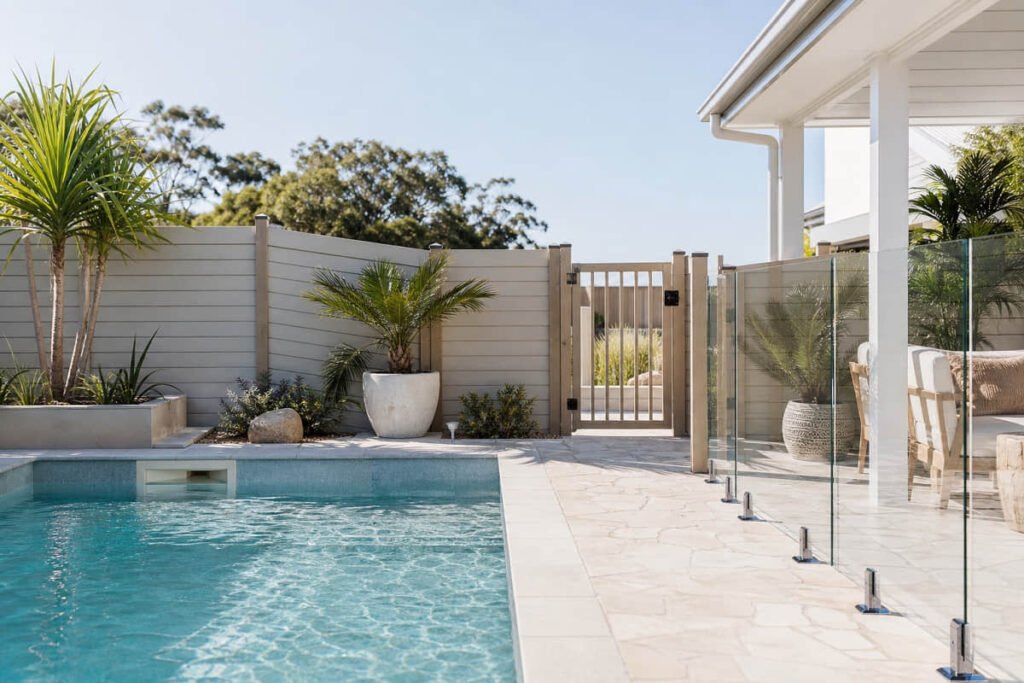 10 Pool Fencing Ideas for Australian Backyards 6 coastal pool fence light grey sand tones