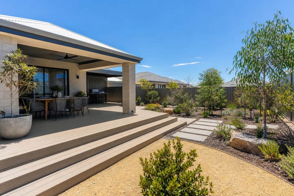 Light-coloured composite deck beside a modern Perth home designed for hot summer conditions