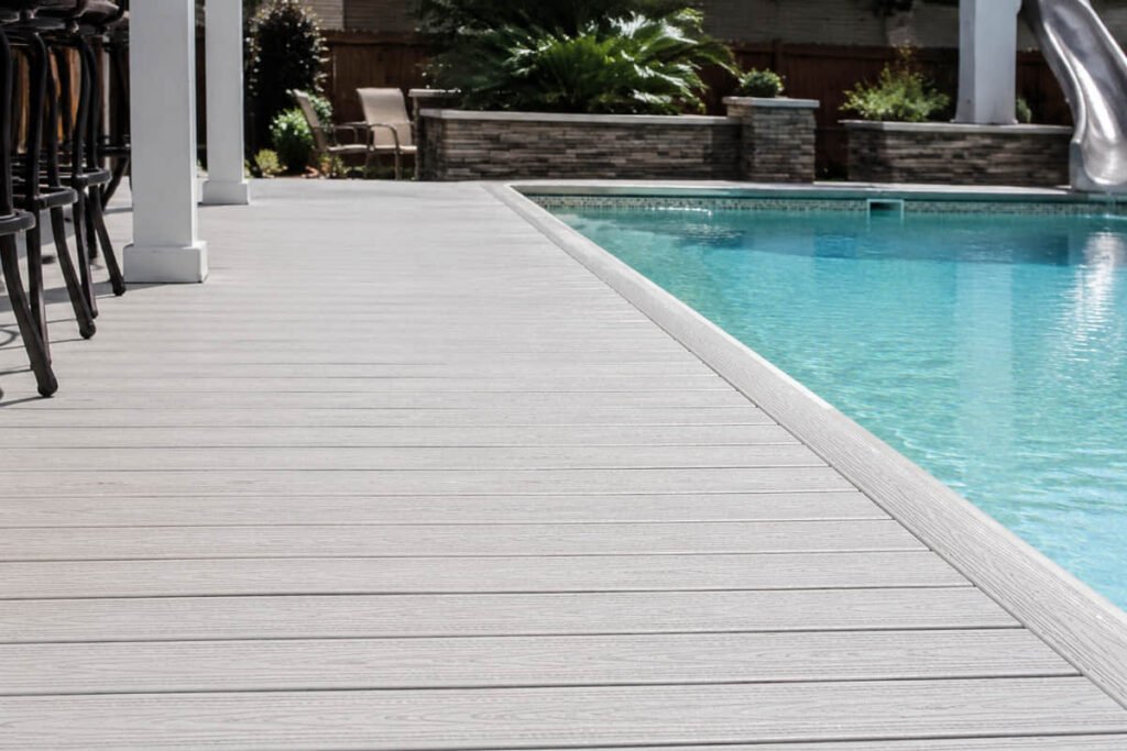 Composite Decking Materials Compared: HDPE vs PVC vs PP 5 composite decking gray poolside installation