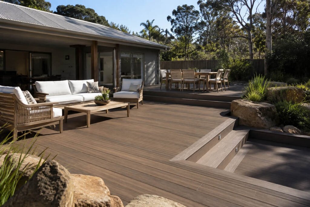 Finished composite deck in backyard with outdoor furniture